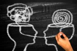 Two humans head silhouette psychotherapy concept